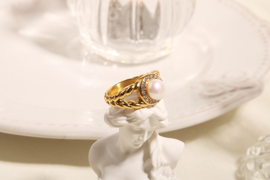 Styling imagery: a gold and pearl ring resting on a white sculpture
