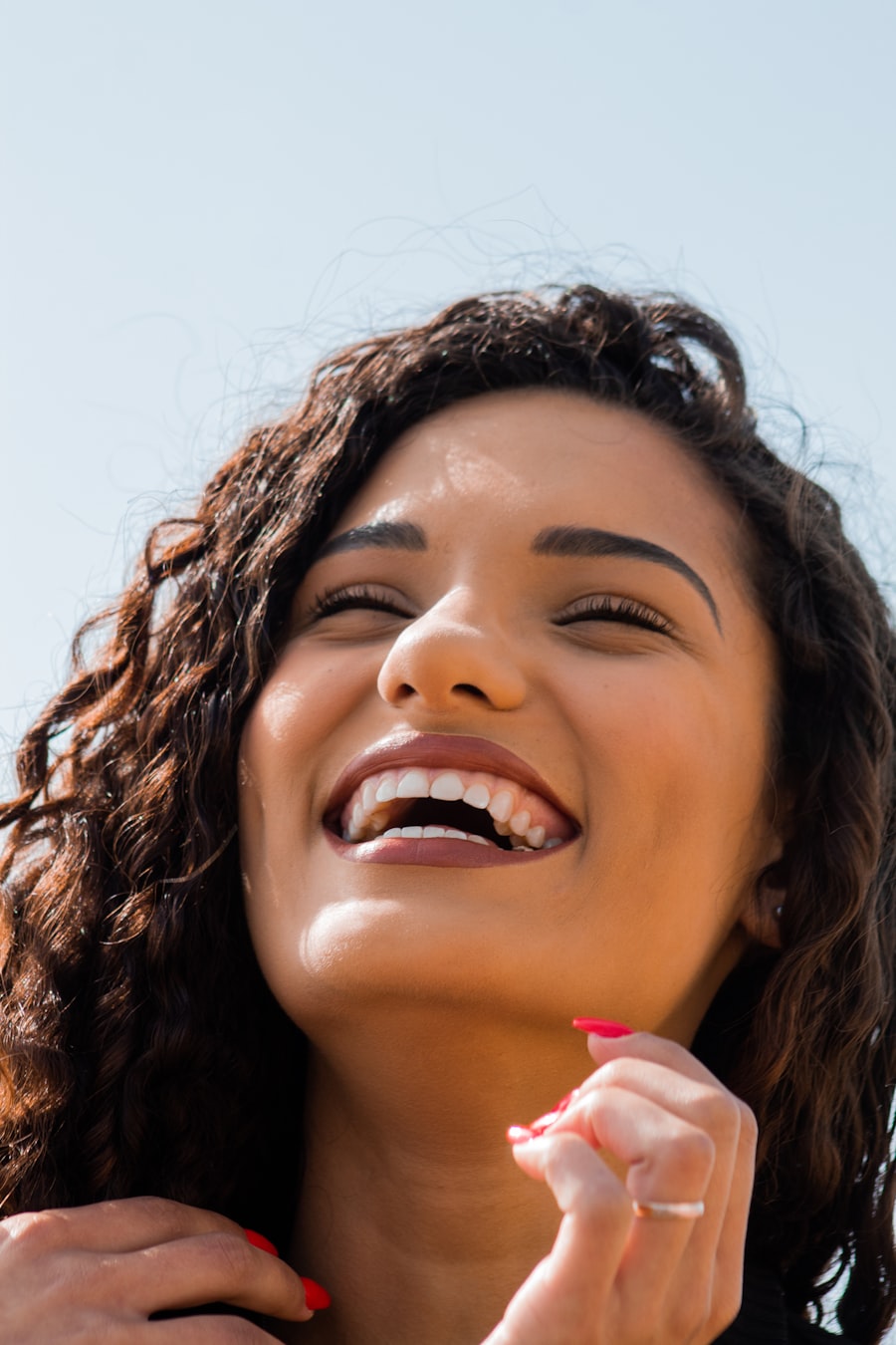 Styling imagery: a young woman laughing in the sunshine